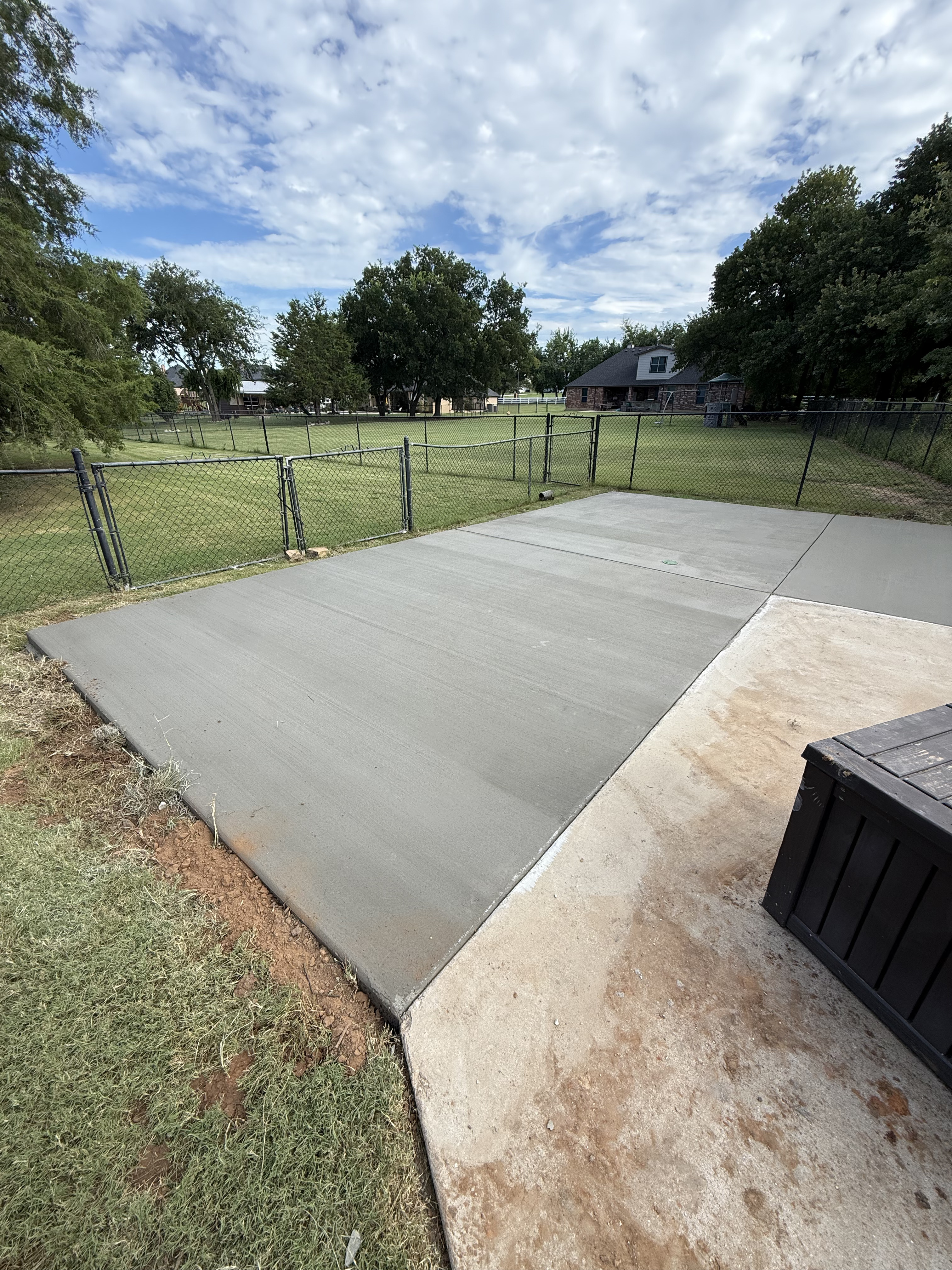 Newly finished residential concrete driveway extension